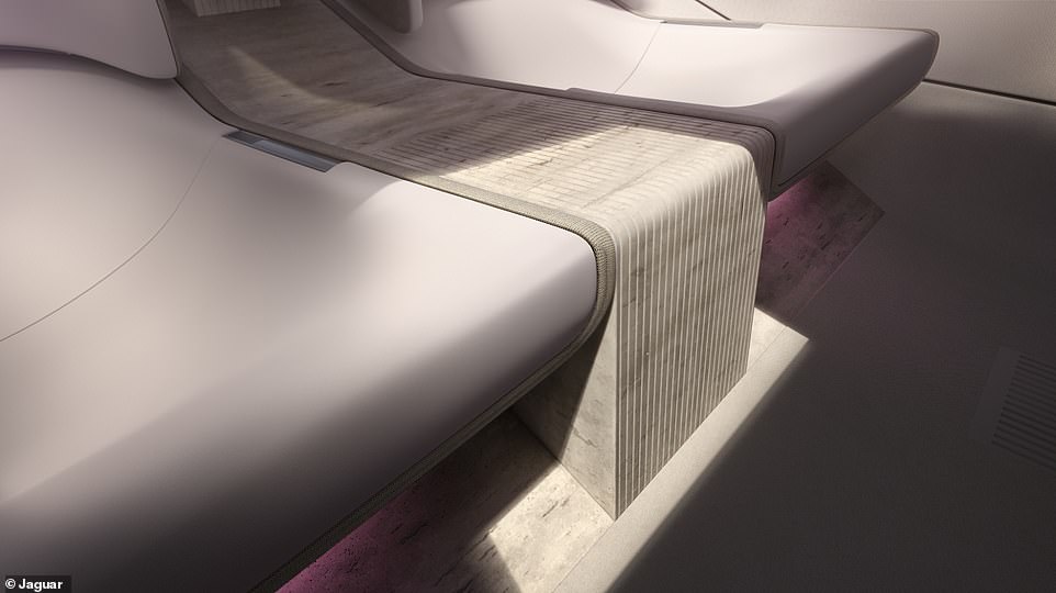 The seats are supported by this travertine stone plinth running through the car