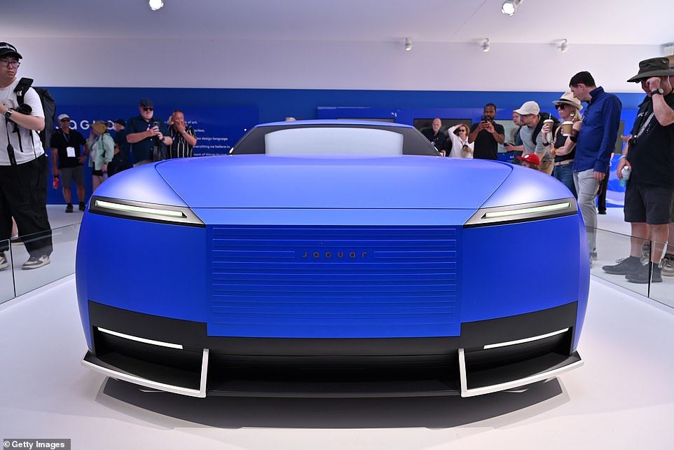 The concept signals the look of future Jaguar EVs. It features an enormously long bonnet, sweeping roofline, no rear window, two upwardly-mobile butterfly-wing doors, flush surfaces and a slatted panoramic roof