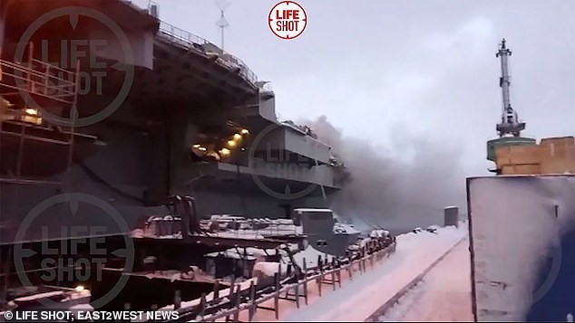 The length of three football pitches, it has been hit by two fires while under repair, in 2019 and 2022, causing millions of pounds worth of damage. Pictured: Fire engulfs the Admiral Kuznetsov in December 2019, in which two men lost their lives