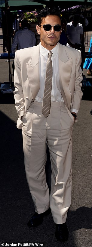 He added a pair of dark shades to the ensemble