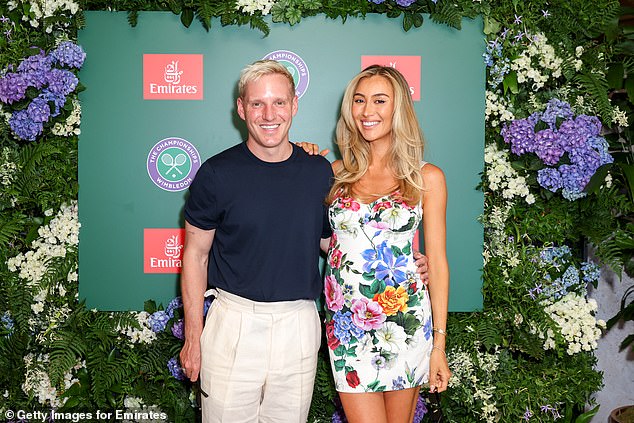 The star posed with her husband Jamie who opted for a simple T-shirt and cream trousers combo