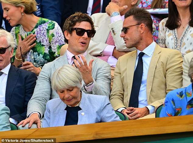 The actor was seen chatting with a pal as he donned a grey jacket and pale pink shirt