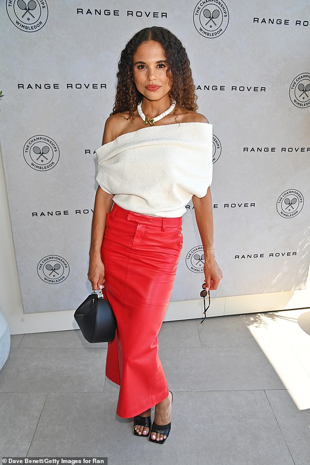 Jessica Plumer wowed in an off the shoulder cream statement top and coral red leather skirt
