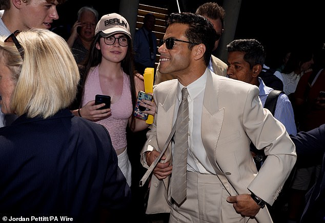 Rami looked in great spirits as he smiled and chatted with fans