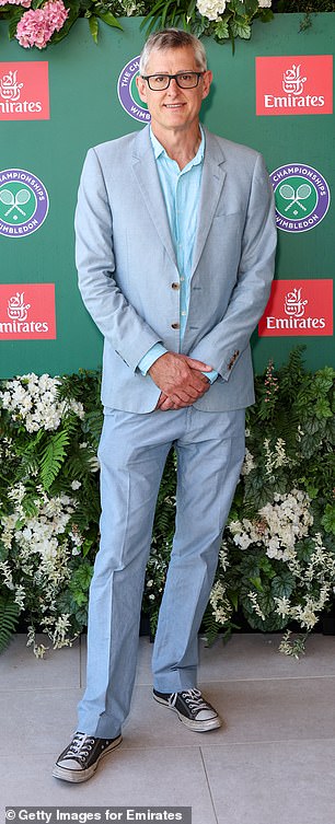Louis Theroux opted for a pale grey jacket and blue trousers before completing the look with black Converse