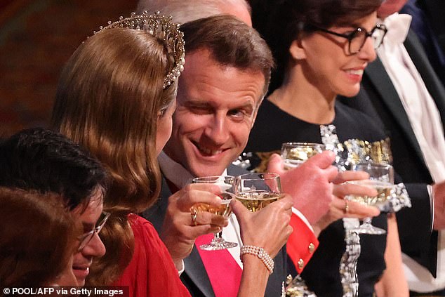 Emmanuel Macron winked as he clinked glasses with the Princess of Wales at last night's state banquet