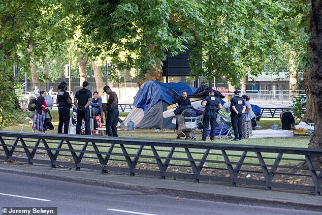 Those living at the site close to some of London's swankiest areas were told to take down their temporary dwellings by enforcement officers