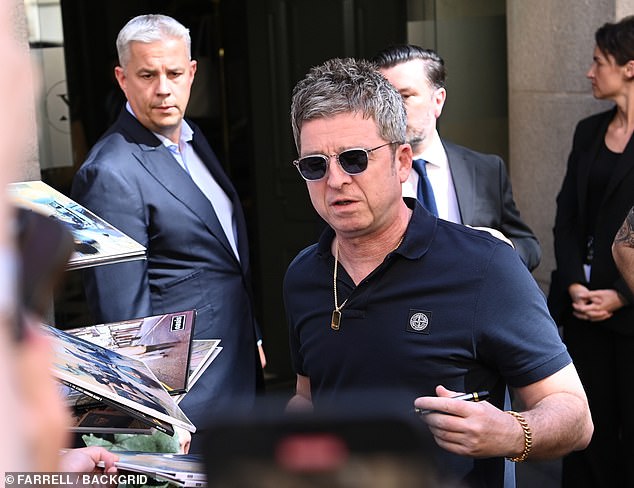 The musician, 58, waved to fans as he emerged from the lobby in a simple black polo, blue jeans, shades and gold chain