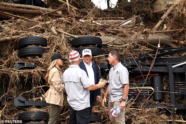 President Donald Trump and first lady Melania Trump speak with first responders, as they visit a scene of devastation along the banks of the Guadalupe River in Kerrville, Texas