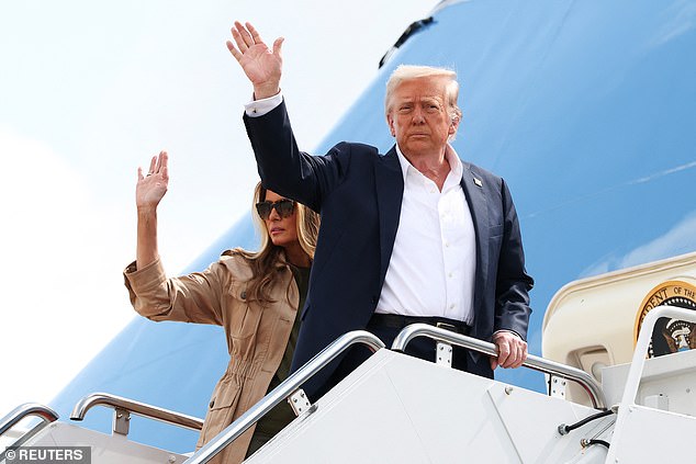 President Donald Trump and first lady Melania Trump wave as they board Air Force One