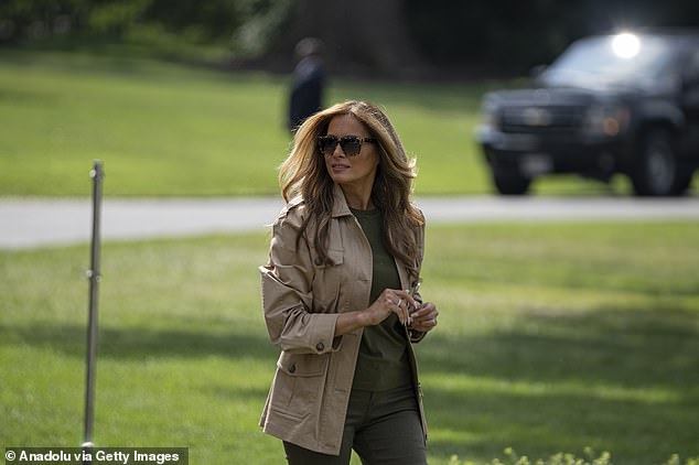 First Lady Melania Trump walks across the South Lawn of the White House