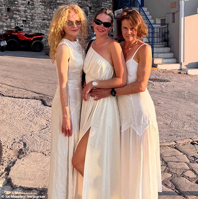 One photo showed Nicole flaunted her naturally curly auburn hair which cascaded down her back, in what was a rare sighting of her trademark locks. Also pictured: Lucia Hawley and Antonia Kidman - Lucia's mother and Nicole's sister