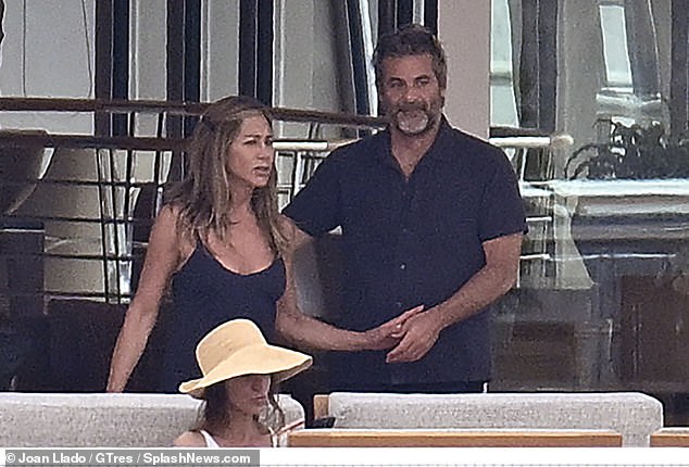 The hot new couple held hands aboard the yacht