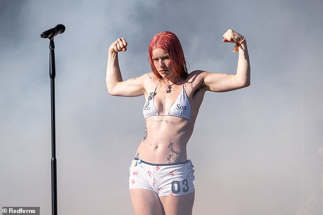 While belting out Wet Leg's biggest tunes, including Wet Dream and Chaise Lounge, Teasdale flexed her biceps while letting her long pink hair flow past her shoulders