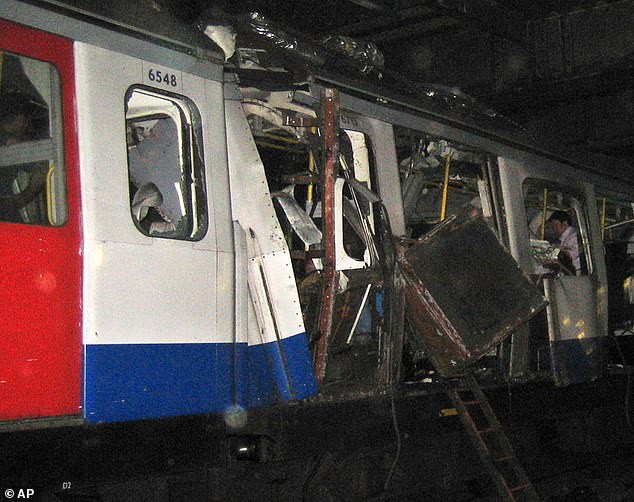 A bomb damaged Circle Line subway train is seen stopped between Liverpool Street and Aldgate staions in London, Thursday, July 7, 2008