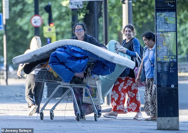 The 30-odd migrants, men and women, started packing up their belongings into M&S shopping trolleys and wheeling them slowly towards Marble Arch