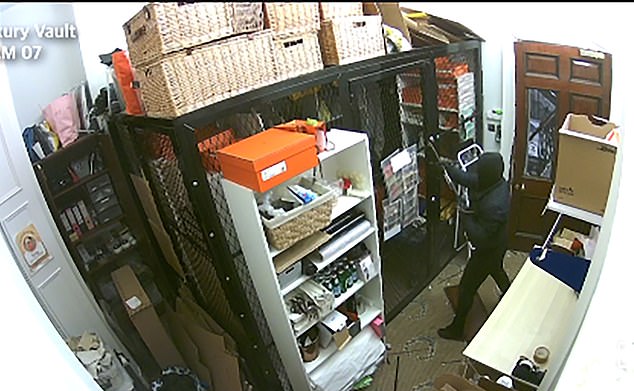 Three men smashed into the £290,000-a-year Georgian property by Marylebone Square in central London and cut into a hidden cage containing hundreds of priceless bags