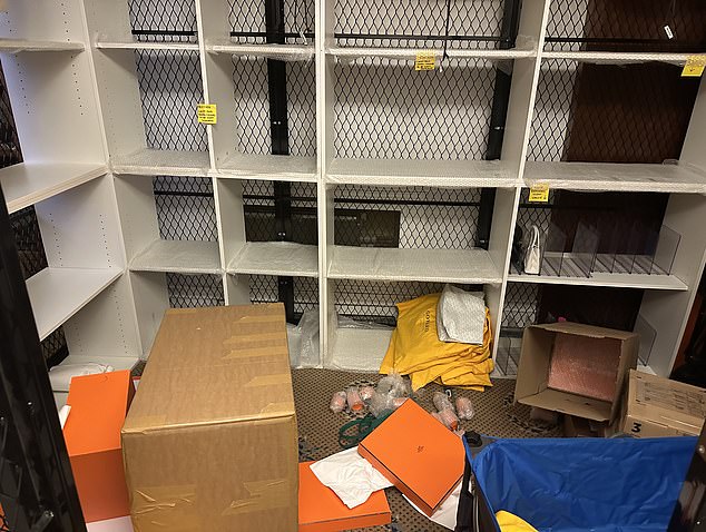 The shelf inside the cage was left ransacked after the thieves stole hundreds of priceless bags