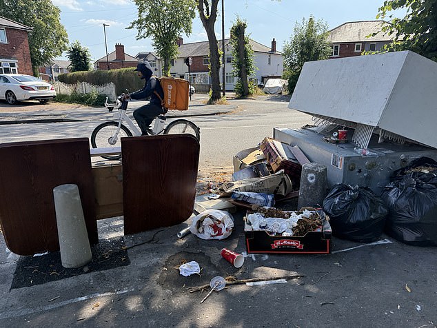 Random rubbish is gathered on street corners amid the 32C heatwave