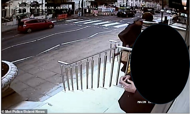 Phillips entering the hotel where he had allegedly booked a room on behalf of the 'Russian agents' - who were actually undercover British security services