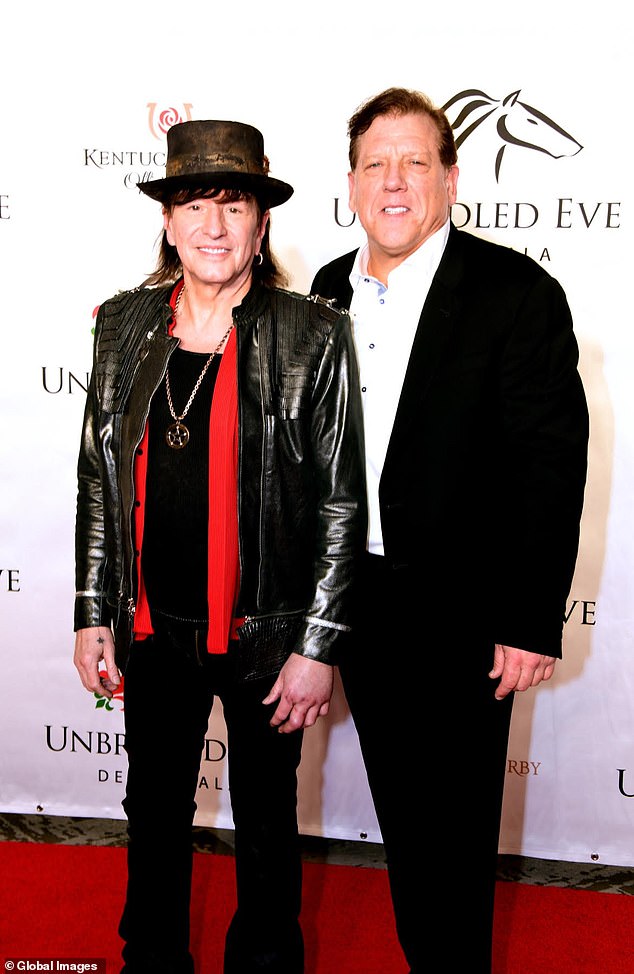 Sambora (left), pictured with his brother-in-law Terry Ahearn (right), delayed his surgery and doctors ultimately had to break his hand to reset it