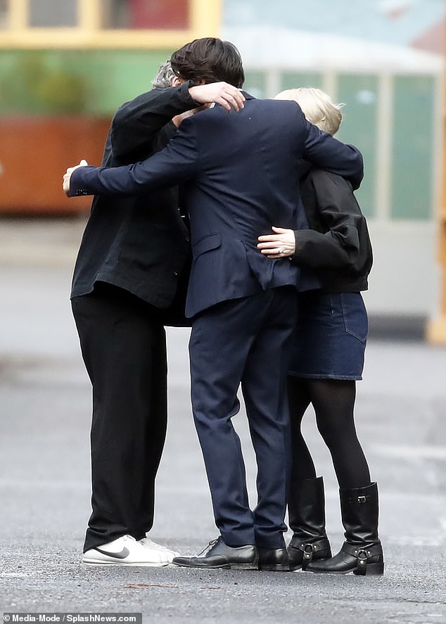 Other members of the crew put on an emotional display as they were seen consoling one another in a group hug