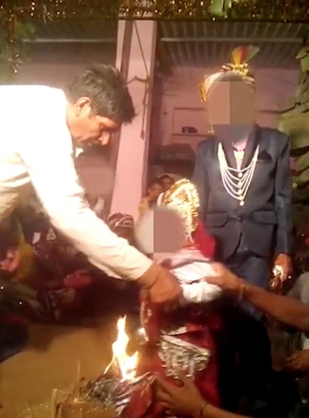 One of the child brides, a five-year-old, is seen dressed in a Hindu bridal dress and is forced to walk around the fire with her child groom, an 11-year-old