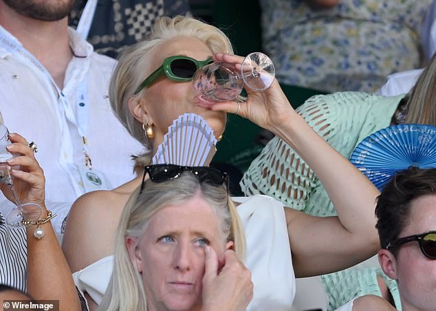 The Ted Lasso star cooled herself down in the London heatwave by swigging a drink during the tense match
