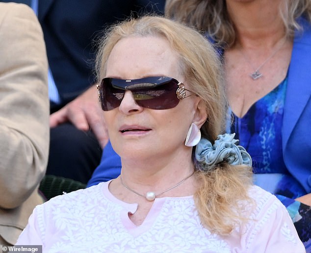 Nicknamed 'Princess Pushy' by the papers, Princess Michael of Kent, 80, dons striking sunglasses and a chunky scrunchie for today's play