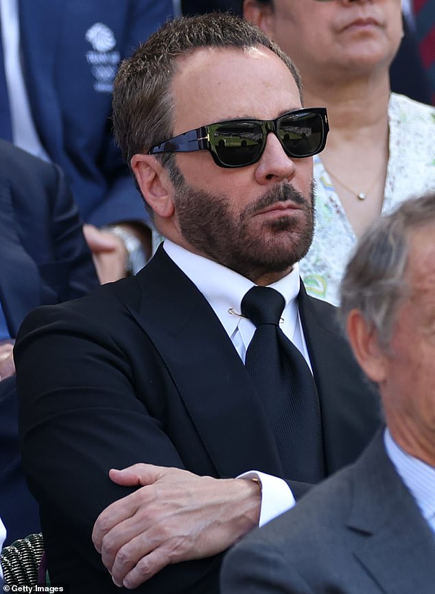 Designer Tom Ford, 63, looked pensively on before the men's singles match between Carlos Alcaraz of Spain and Taylor Fritz of the US