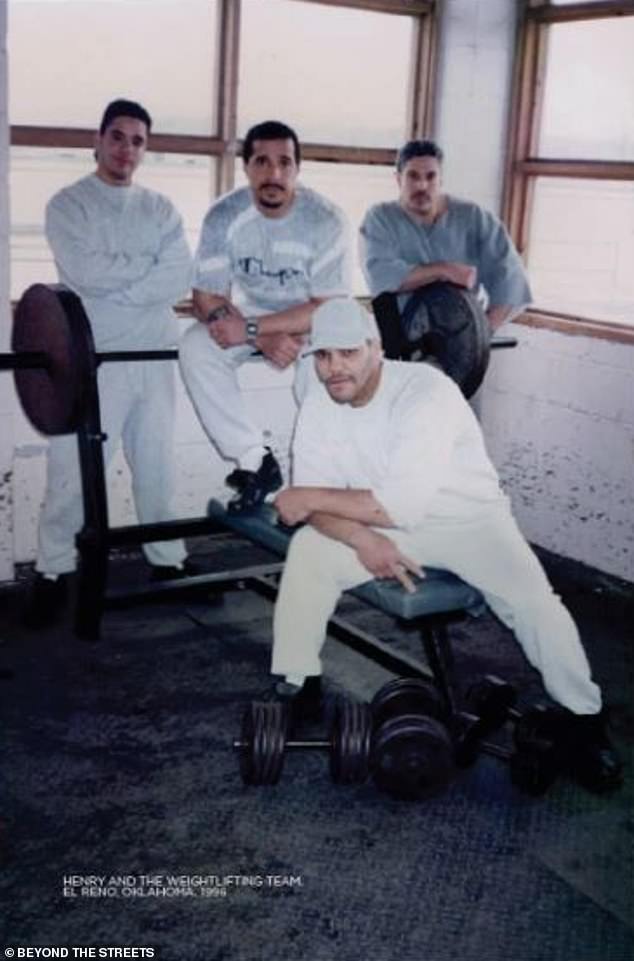Henry, back, centre, now says he suffers from severe PTSD after everything he has experienced