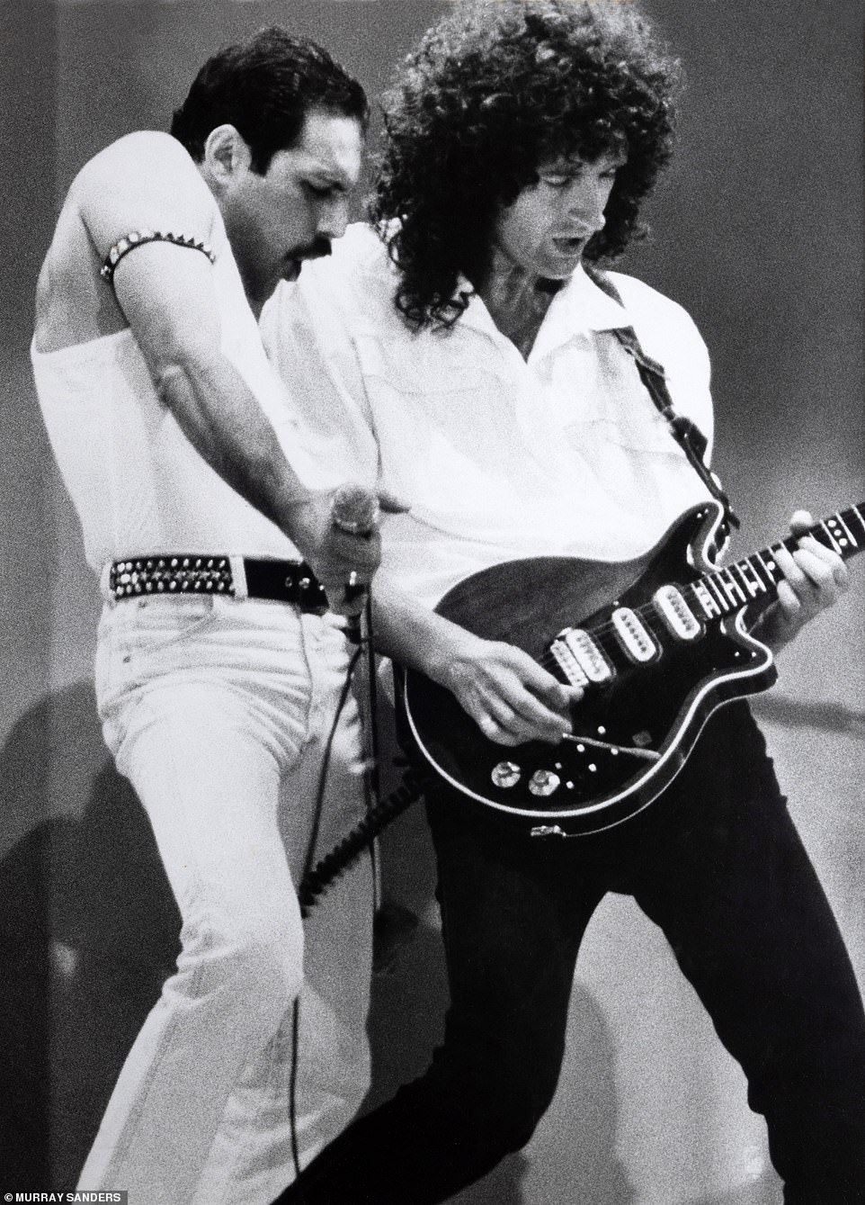 Freddie Mercury performing at Wembley Stadium with the lead guitarist of Queen, Sir Brian May