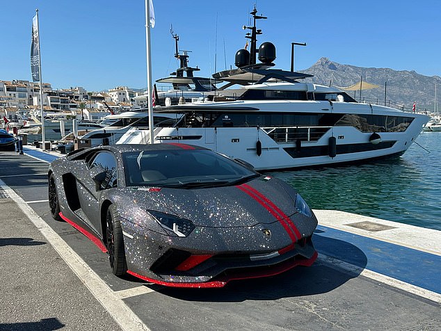 Everywhere you look, there is a fancy car parked beside the sparkling Mediterranean Sea