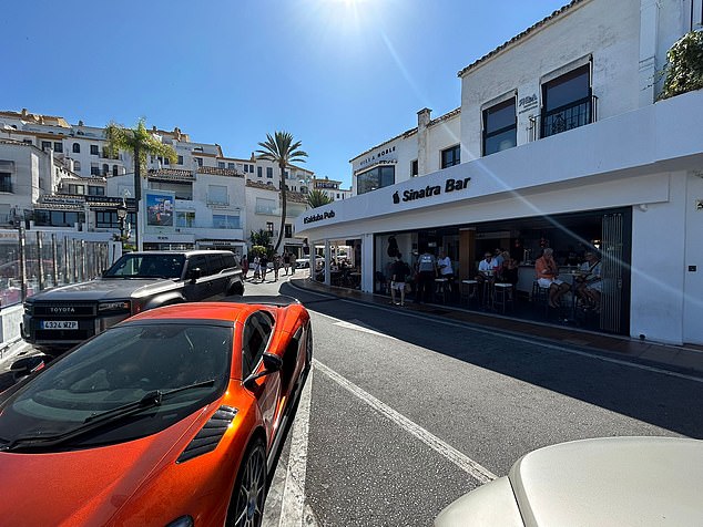 When MailOnline visited notorious gang haunt Sinatra Bar in Marbella, two luxury cars were parked outside