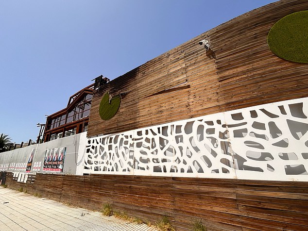 The hotel, which was set ablaze in August 2020, is now boarded up but still has CCTV outside