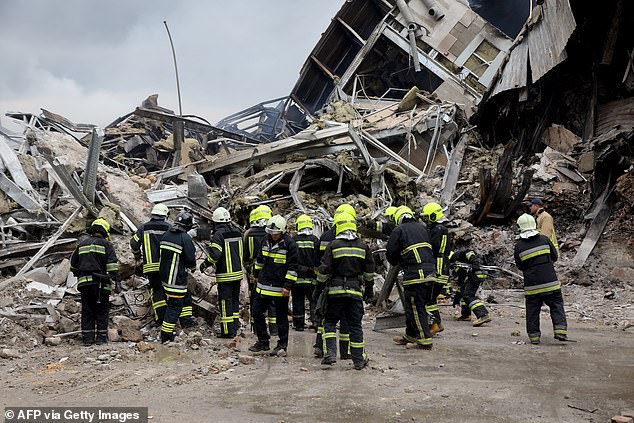Pictured is the aftermath of a Russian missile strike in Odesa, Ukraine, which levelled a building