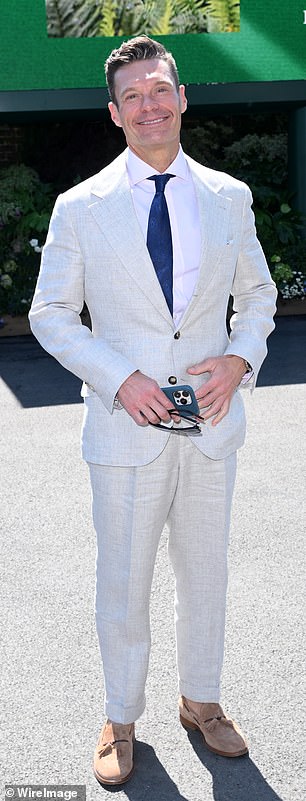 American presenter Ryan Seacrest opted for a white linen suit and blue tie