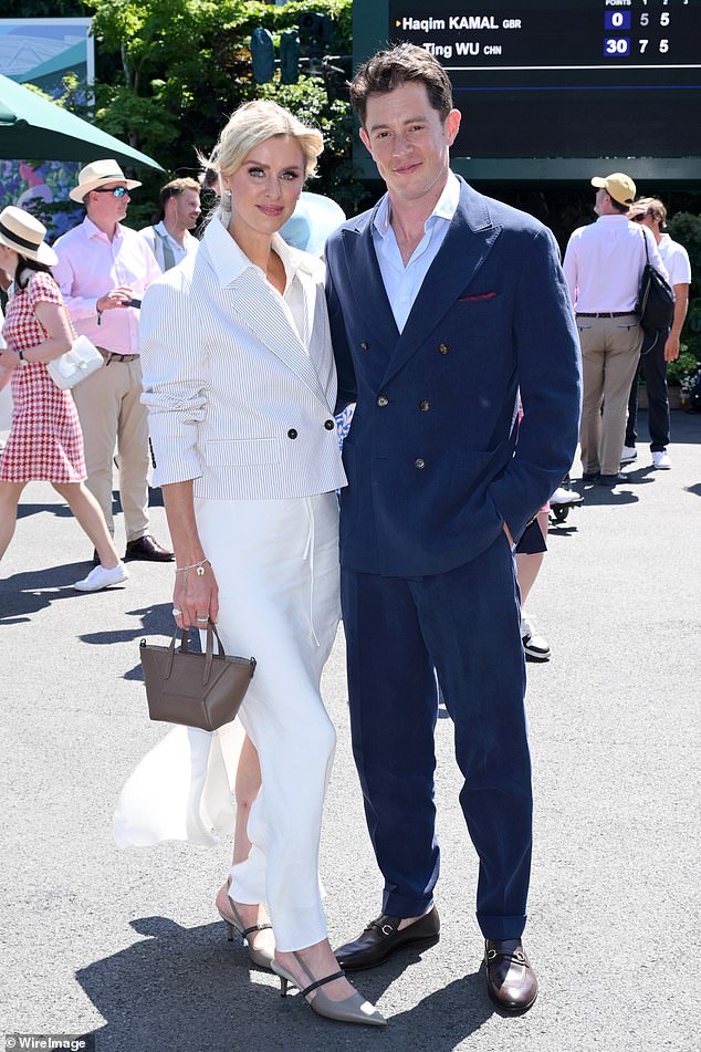Nicky was also joined by her husband James who opted for a navy suit and brown shoes