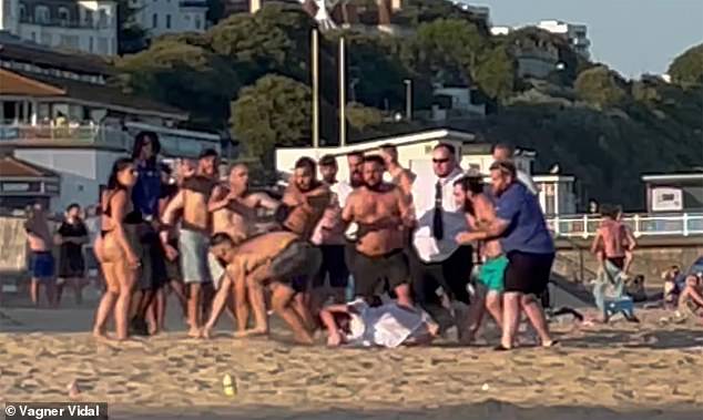 Brawling sun-seekers could be seen stumbling over each other on the sand during the chaos