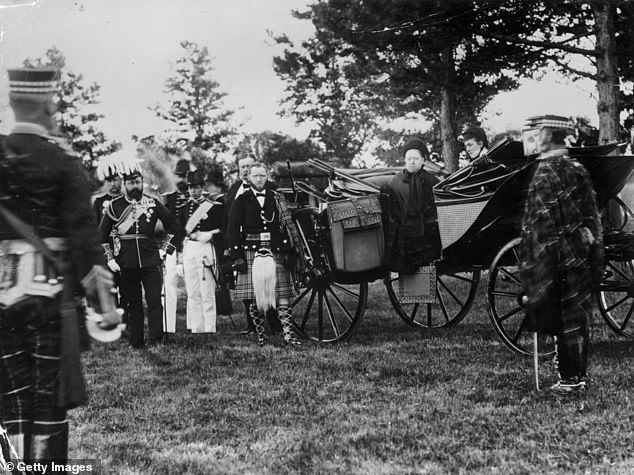 After John's death, she is said to have started work on a biography of him. Pictured: Victoria with John (centre, in kilt) at Windsor in 1881