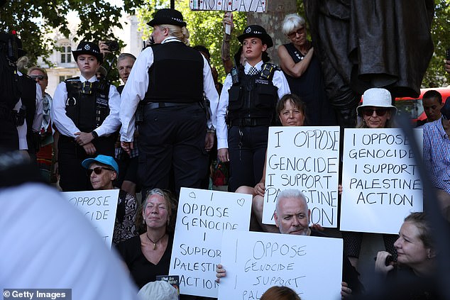 The group was surrounded by Met Police officers who formed a cordon around them