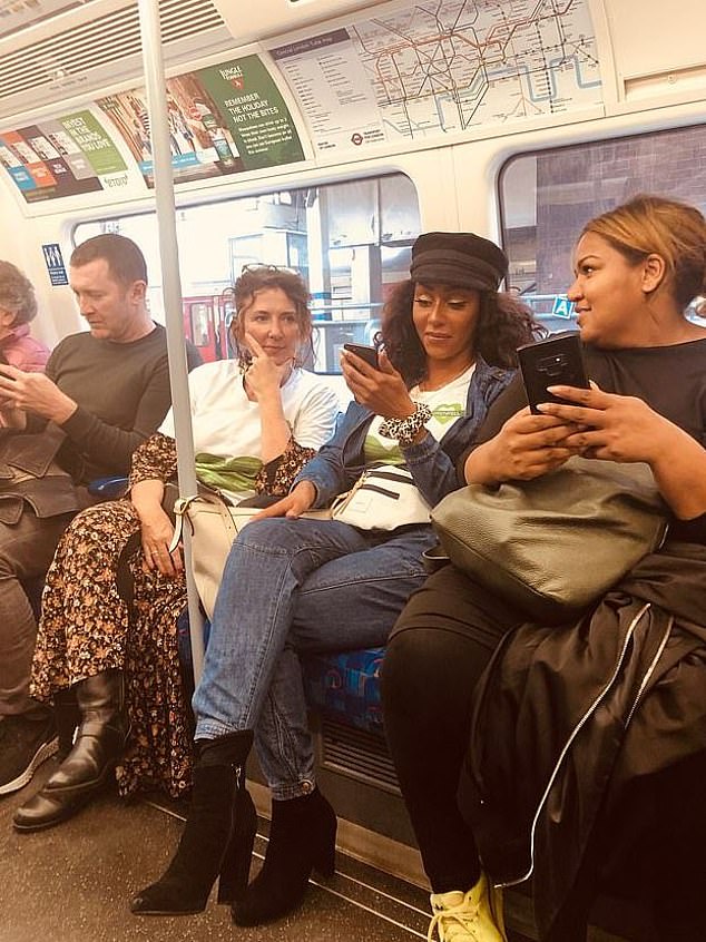Mel B proved she was just like the rest of us, as she touched up her make-up on a Jubilee line tube with a compact mirror in 2023