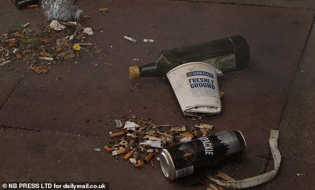 Cigarette ends and empty cans left among piling rubbish in the once thriving town