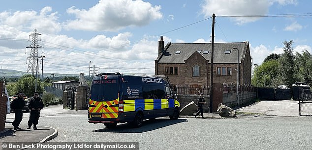 Around a dozen police vehicles and 20 uniformed cops descended upon the site in the early hours of Monday morning