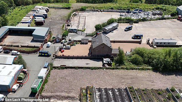 An aerial view of the house and the scrapyard. Families had also been living in caravans on the scrapyard and were evicted