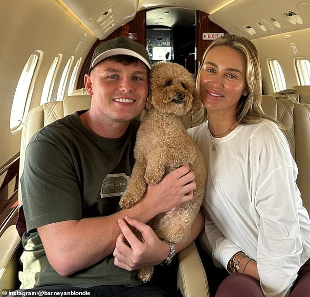 Lee, the son of Kinahan gangster Liam Byrne, has been welcomed into the Gerrard family, here posing with one of the Gerrard's dogs and Steven's wife, the model Alex Curran