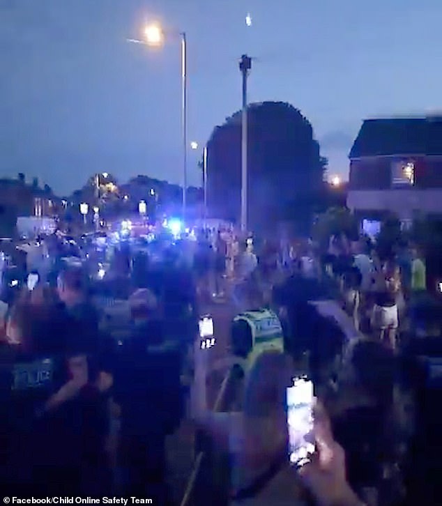 Officers lined up and formed barricades, with the rioters appearing to launch projectiles in their direction