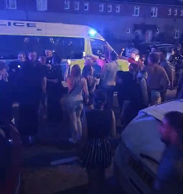 As crowds began arriving onto Middle Park Way - officers were quickly met with a large and increasingly angry mob
