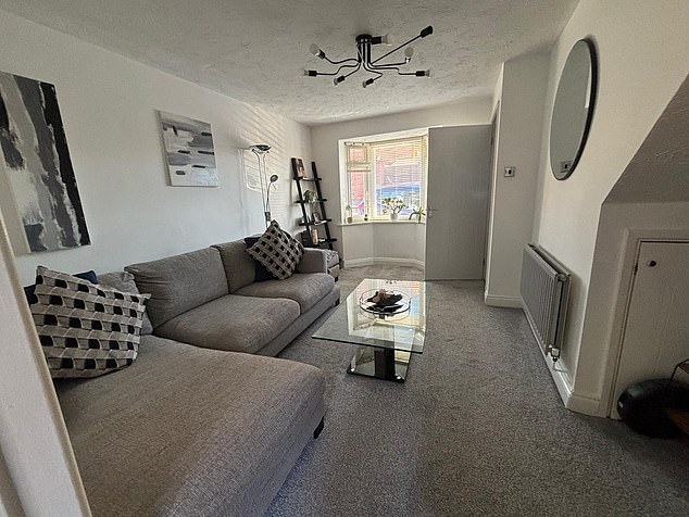 The property includes a porch, a living room, a kitchen with integrated appliances, a conservatory, two double bedrooms and a family bathroom