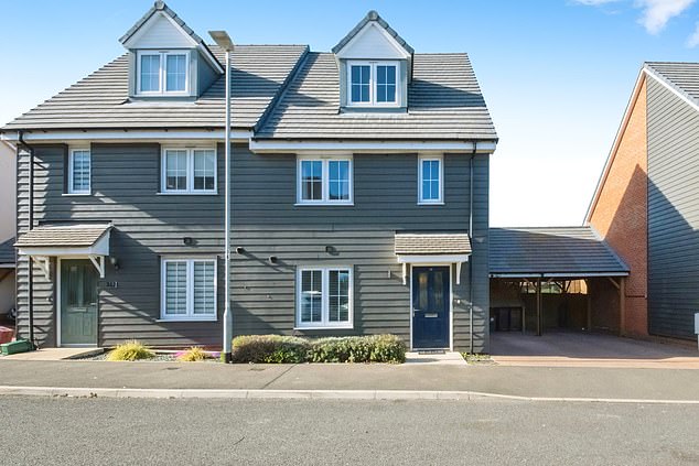 The home has three bathrooms (one en suite) and has a private bar in the garden